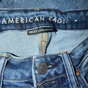American Eagle light blue denim jeans with gold stitching